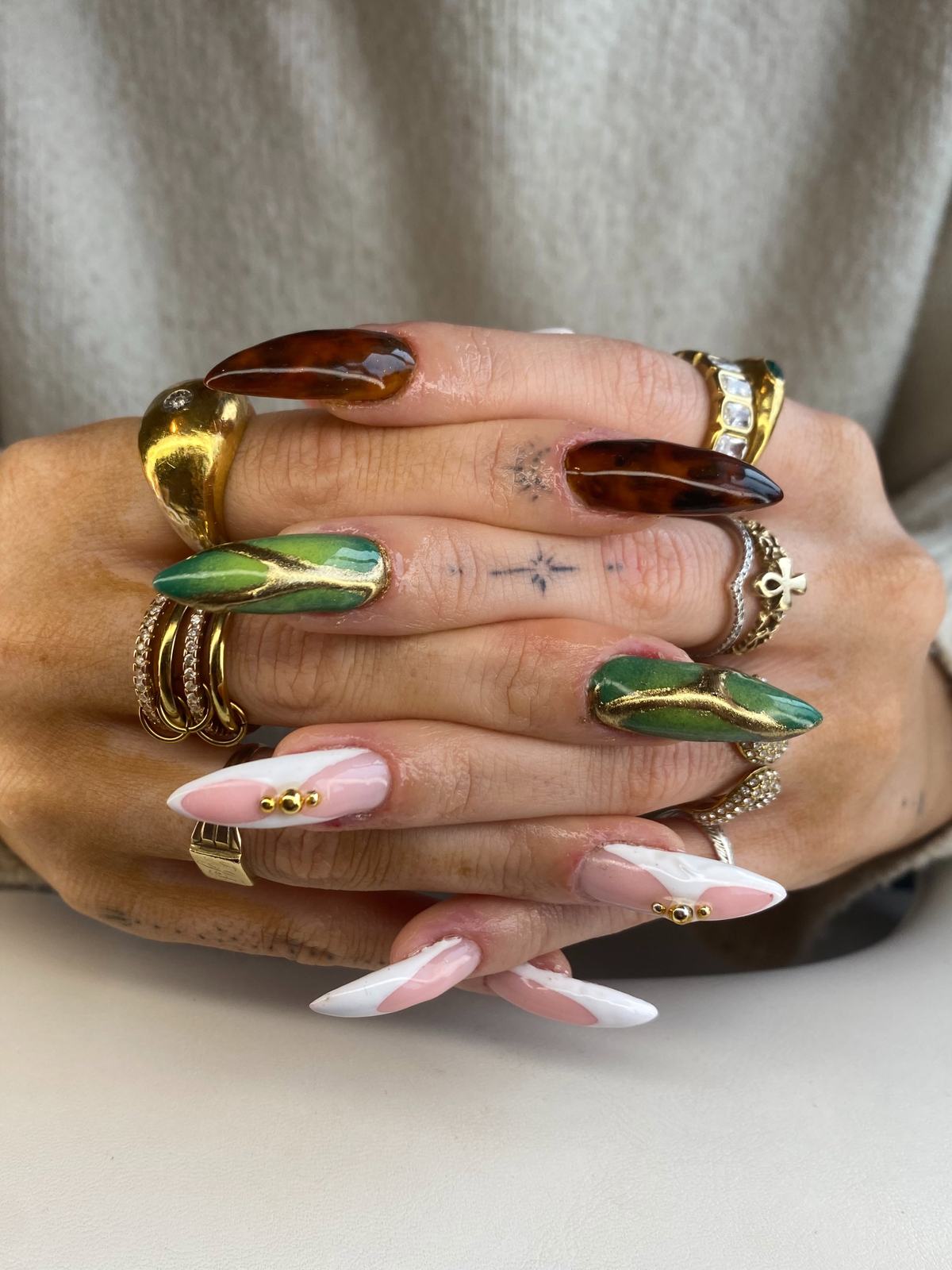 Stiletto set in green chrome, tortoiseshell and pink and white French with gold beads